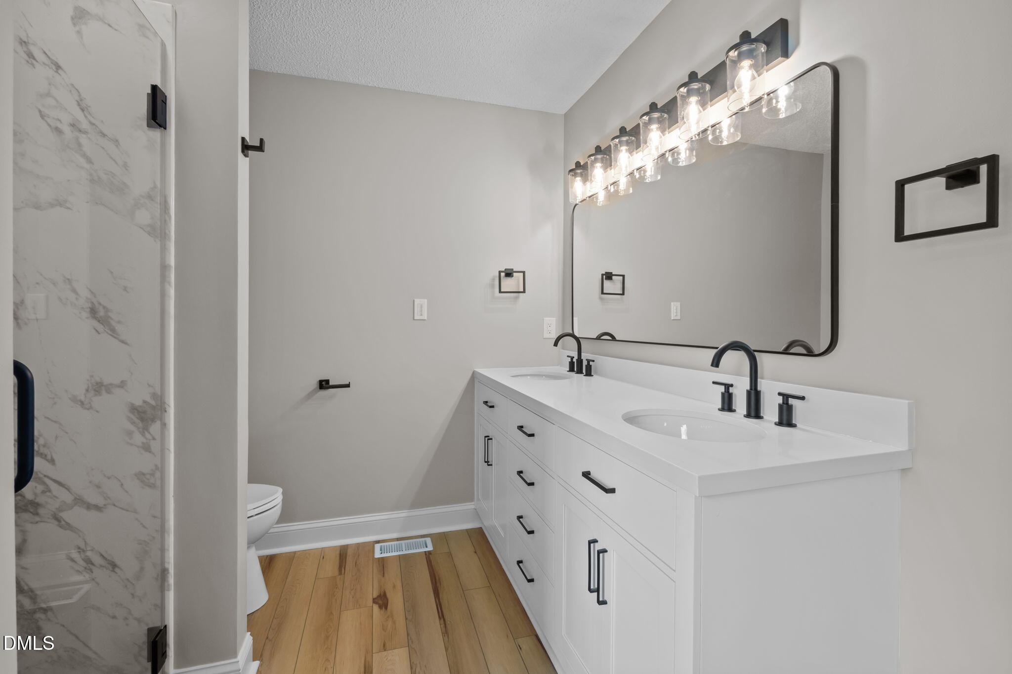 2008 Red Mountain Road Rougemont, NC 27572 - Photo 18 of 31 a bathroom with a double vanity sink mirror and double