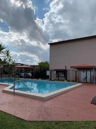 a view of a houses with backyard