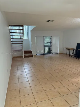 a view of a livingroom with a sink and a window