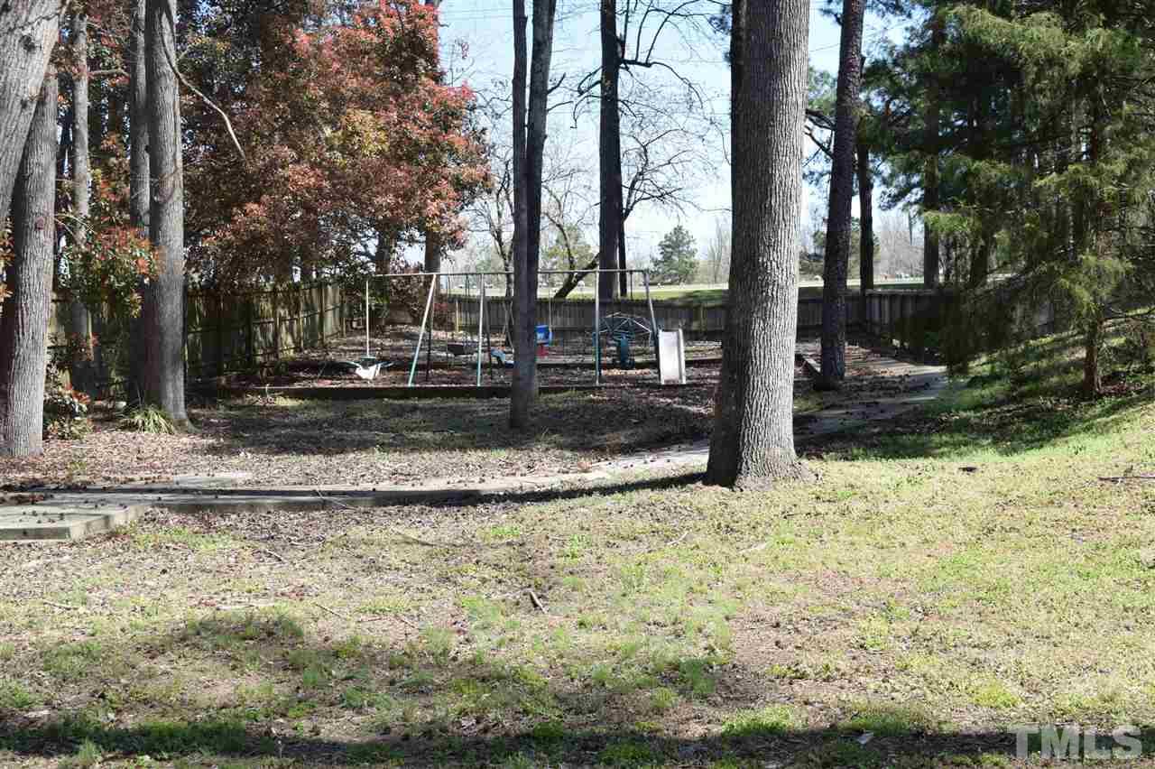 1513 Creech Road Garner, NC 27529 - Photo 9 of 10 a view of a yard with a tree