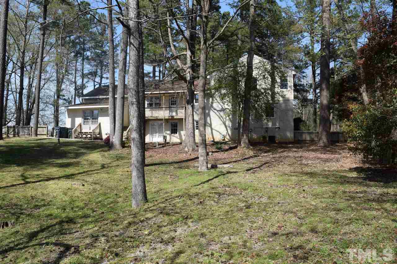 1513 Creech Road Garner, NC 27529 - Photo 10 of 10 a view of a tree in the middle of a yard