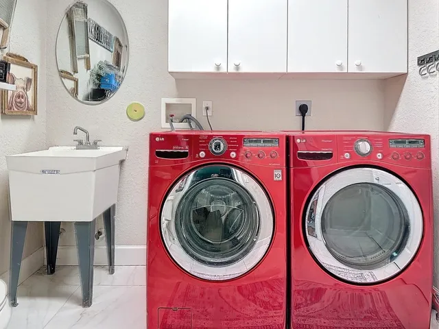 a utility room with dryer and washer