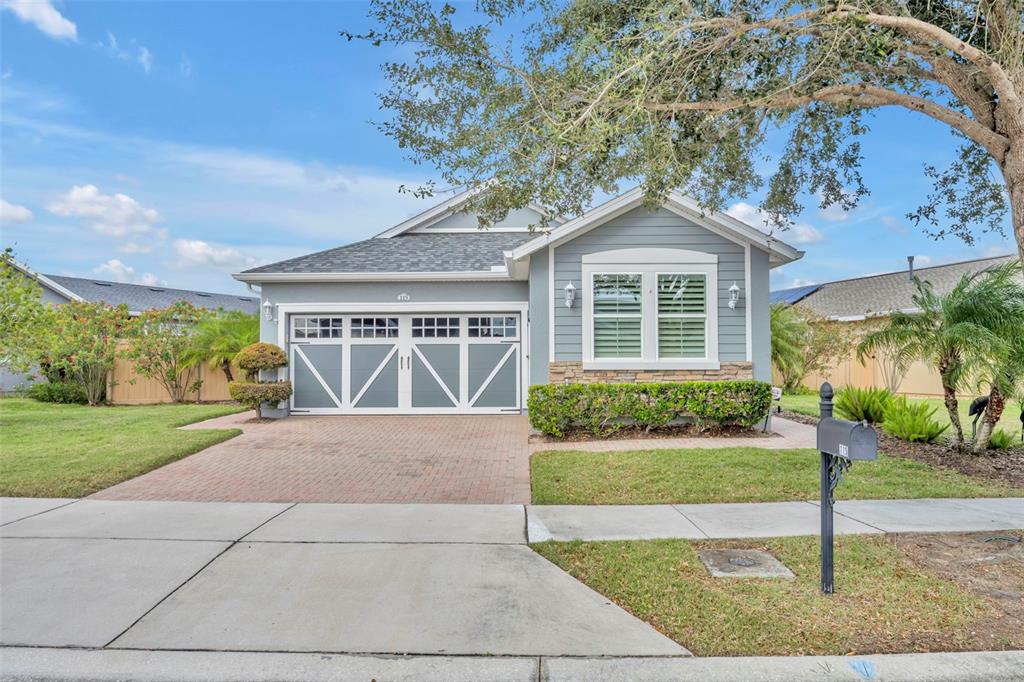 115 Bayou Bend Road Groveland, FL 34736 - Photo 1 of 47 a front view of a house with a yard and potted plants