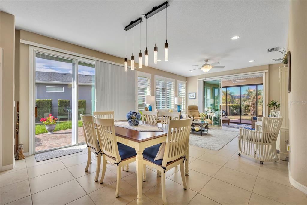 115 Bayou Bend Road Groveland, FL 34736 - Photo 14 of 47 a view of a dining room and livingroom with furniture wooden floor and a rug