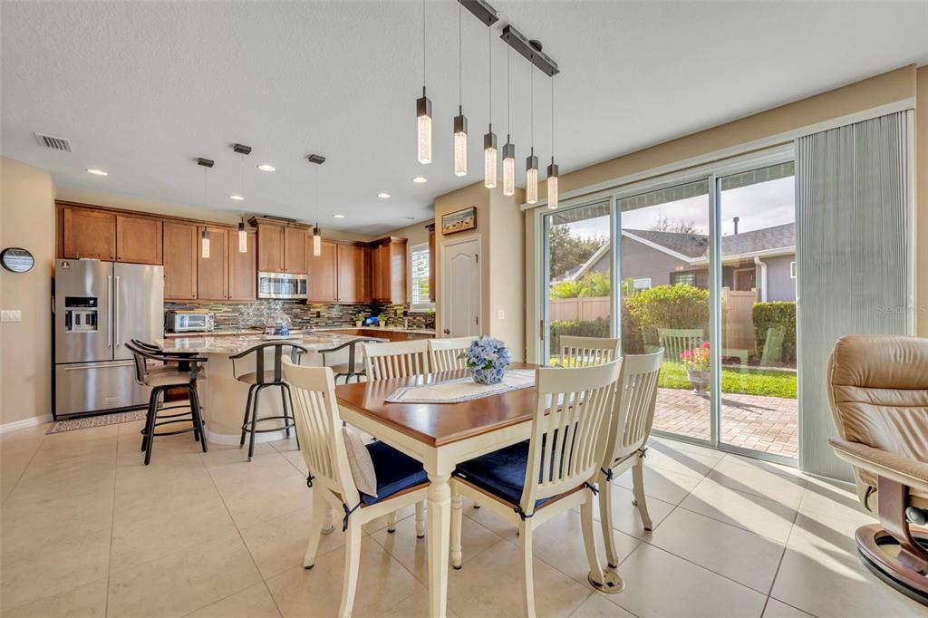 115 Bayou Bend Road Groveland, FL 34736 - Photo 16 of 47 a view of a dining room with furniture window and outside view
