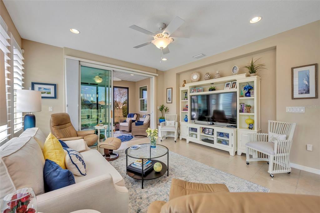 115 Bayou Bend Road Groveland, FL 34736 - Photo 18 of 47 a living room with furniture and a flat screen tv