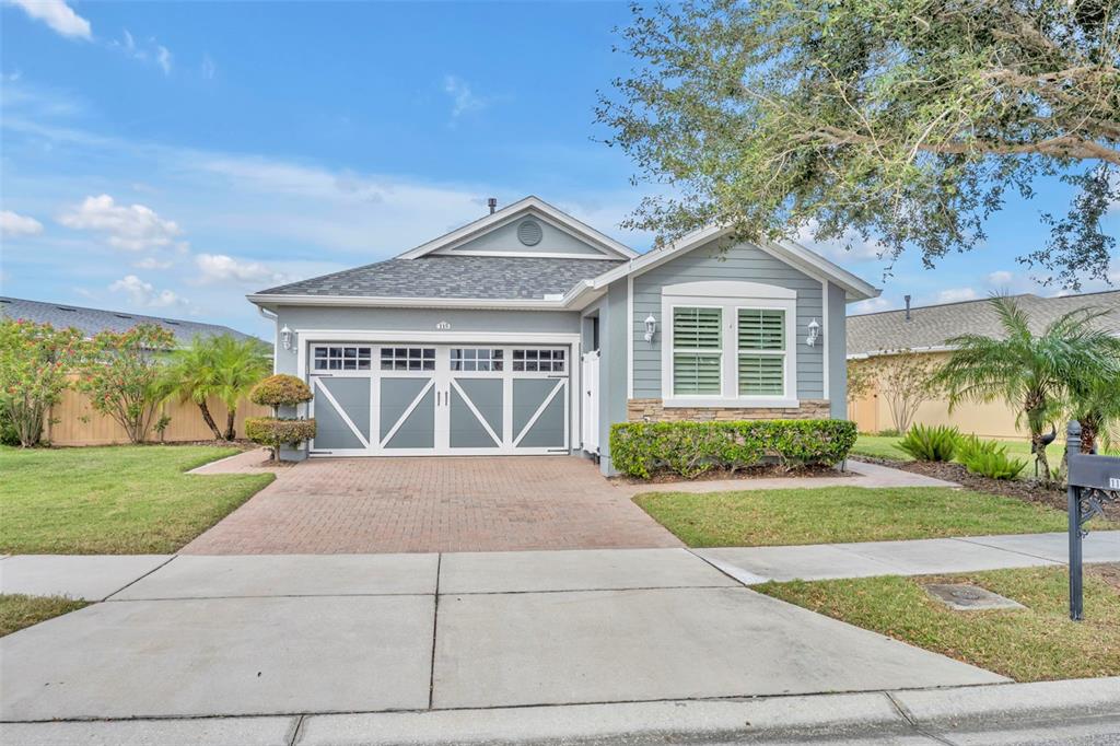 115 Bayou Bend Road Groveland, FL 34736 - Photo 2 of 47 a front view of a house with a yard and potted plants