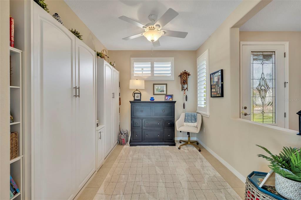 115 Bayou Bend Road Groveland, FL 34736 - Photo 23 of 47 a view of a hallway with a window and a livingroom