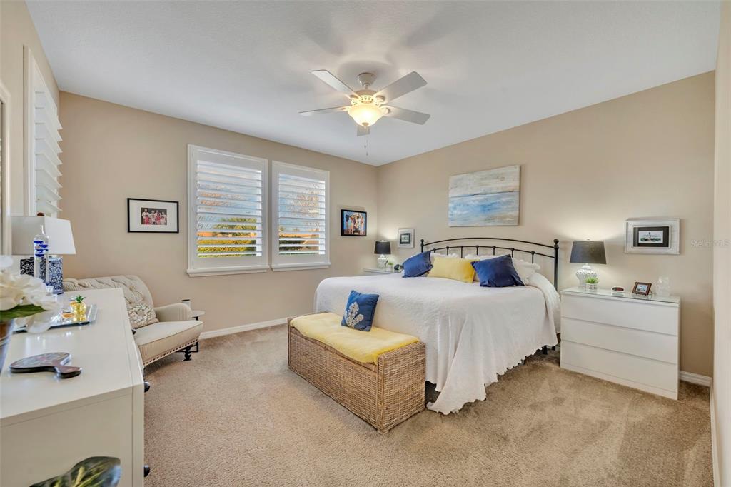 115 Bayou Bend Road Groveland, FL 34736 - Photo 24 of 47 a spacious bedroom with a bed and a couch