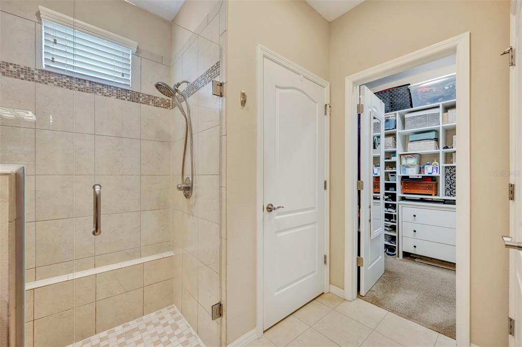 115 Bayou Bend Road Groveland, FL 34736 - Photo 27 of 47 a bathroom with a bathtub and a shower