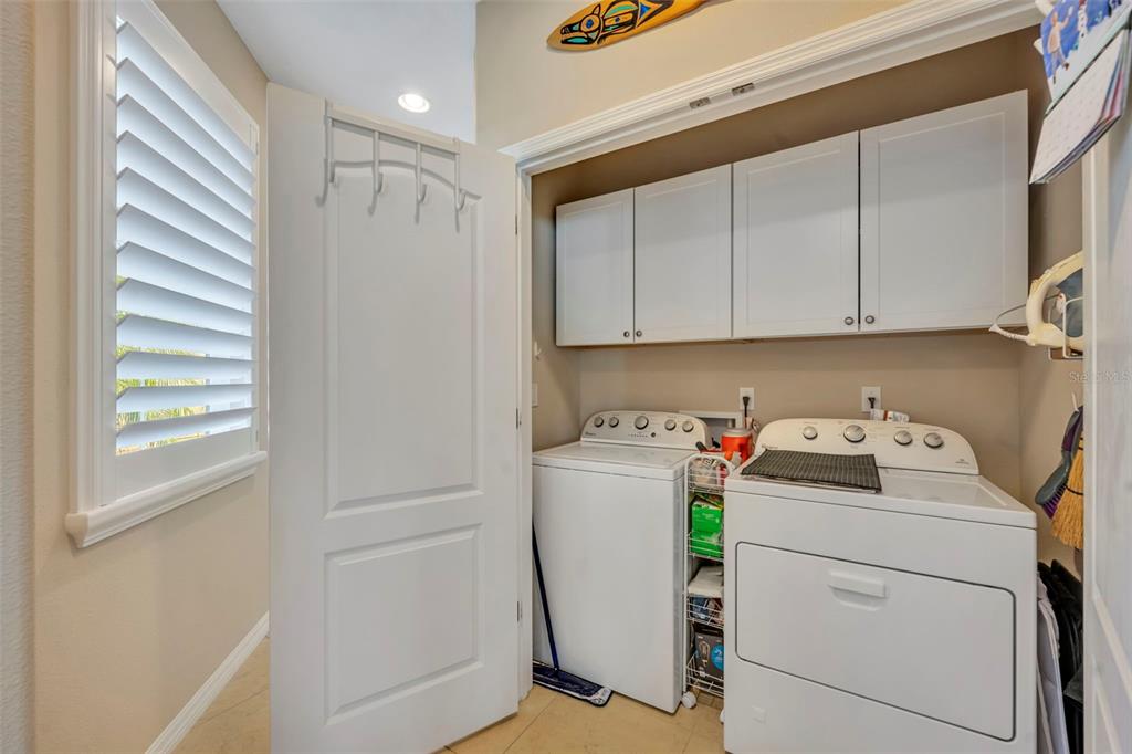 115 Bayou Bend Road Groveland, FL 34736 - Photo 30 of 47 a view of storage and utility room with washer and dryer