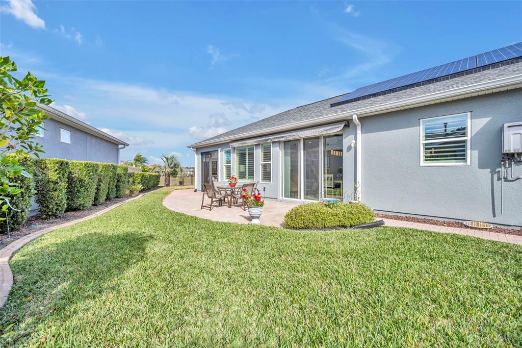 115 Bayou Bend Road Groveland, FL 34736 - Photo 32 of 47 a view of a house with backyard and porch