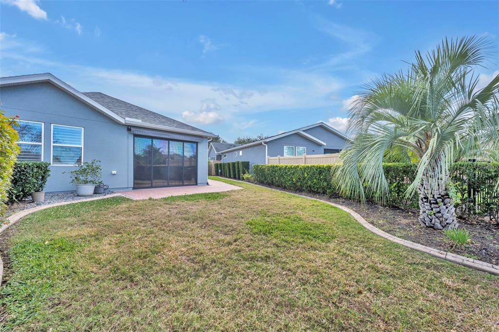 115 Bayou Bend Road Groveland, FL 34736 - Photo 36 of 47 a house with yard and a trees in front of it