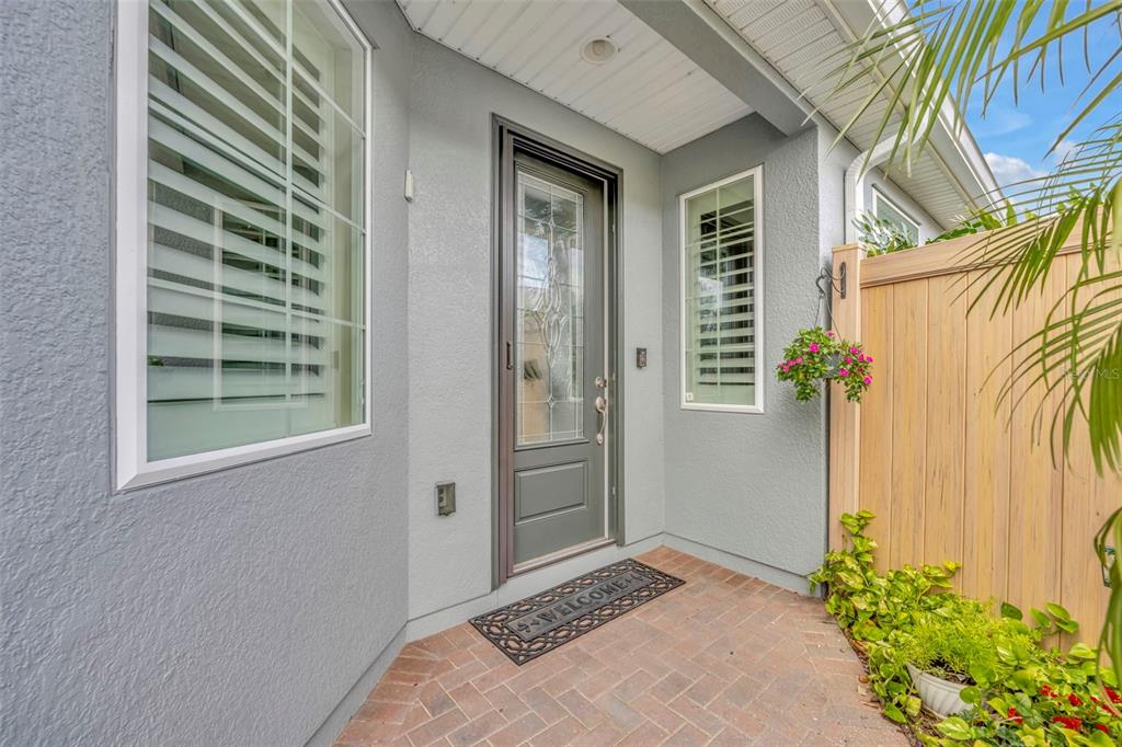 115 Bayou Bend Road Groveland, FL 34736 - Photo 4 of 47 a bedroom with a bed and a potted plant
