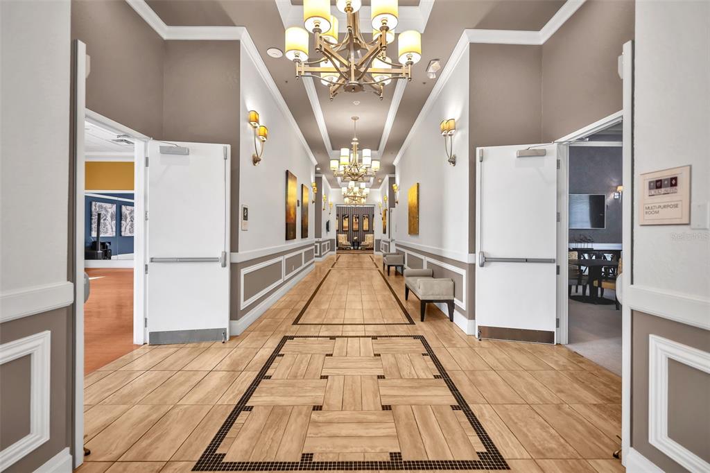 115 Bayou Bend Road Groveland, FL 34736 - Photo 42 of 47 a view of entryway with wooden floor and a chandelier