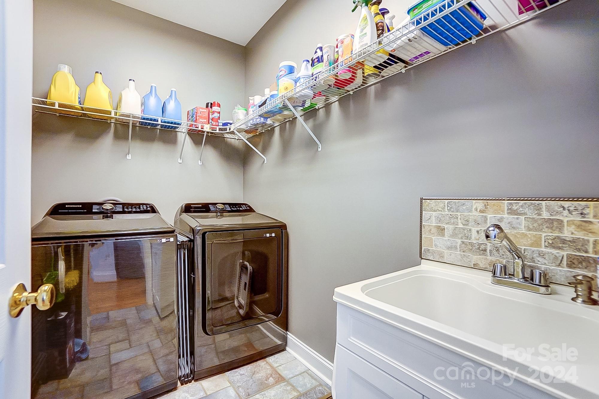 814 Pine Forest Road Charlotte, NC 28214 - Photo 11 of 26 a bathroom with a tub sink and cabinets