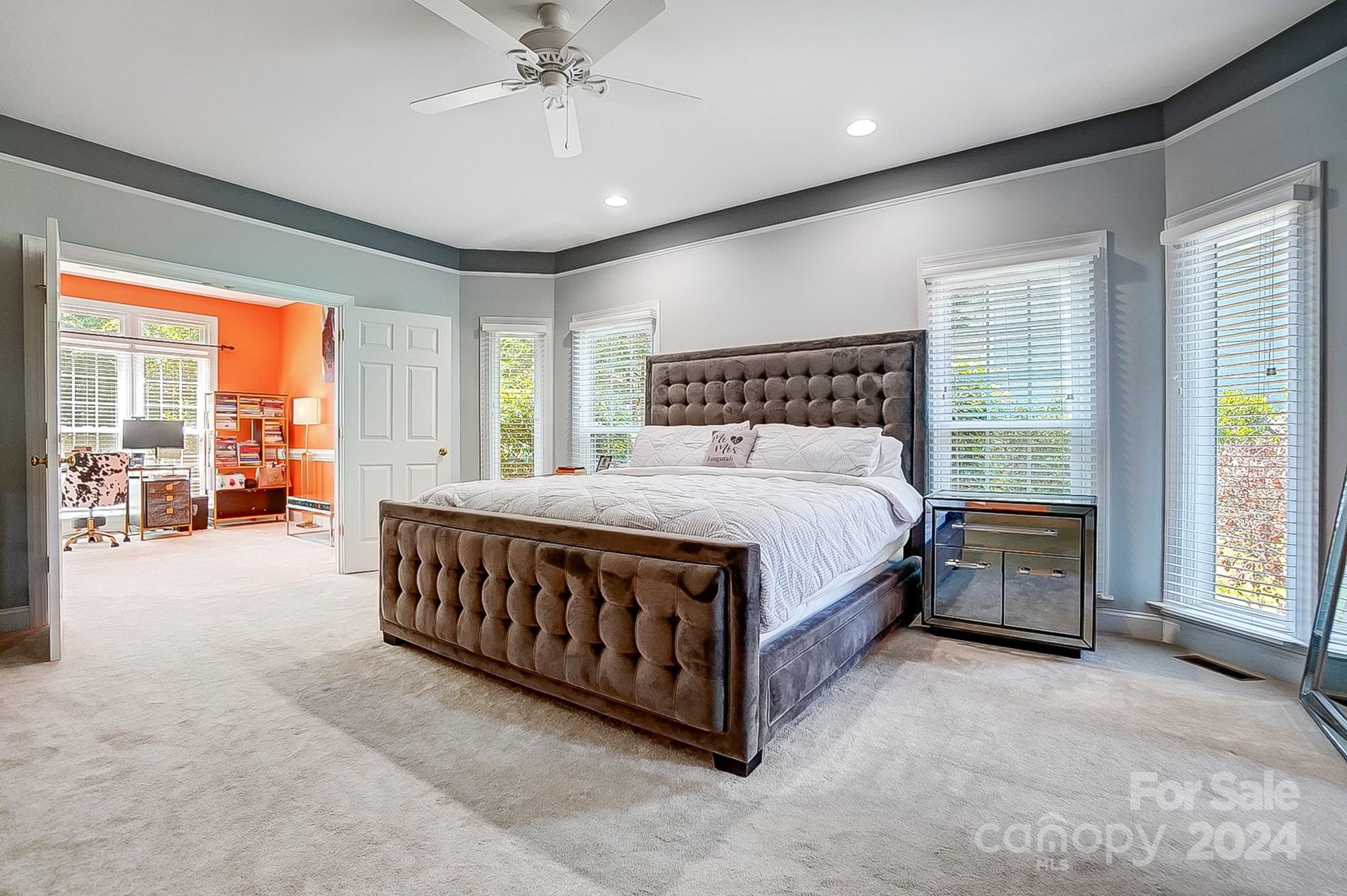 814 Pine Forest Road Charlotte, NC 28214 - Photo 12 of 26 a large bed sitting in a room next to a window