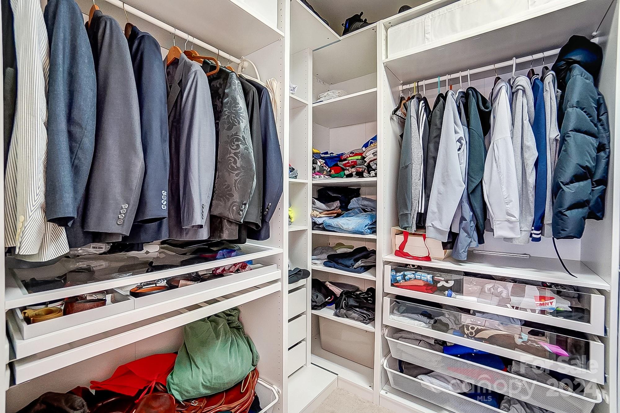 814 Pine Forest Road Charlotte, NC 28214 - Photo 15 of 26 a view of walk in closet with clothes and shoes