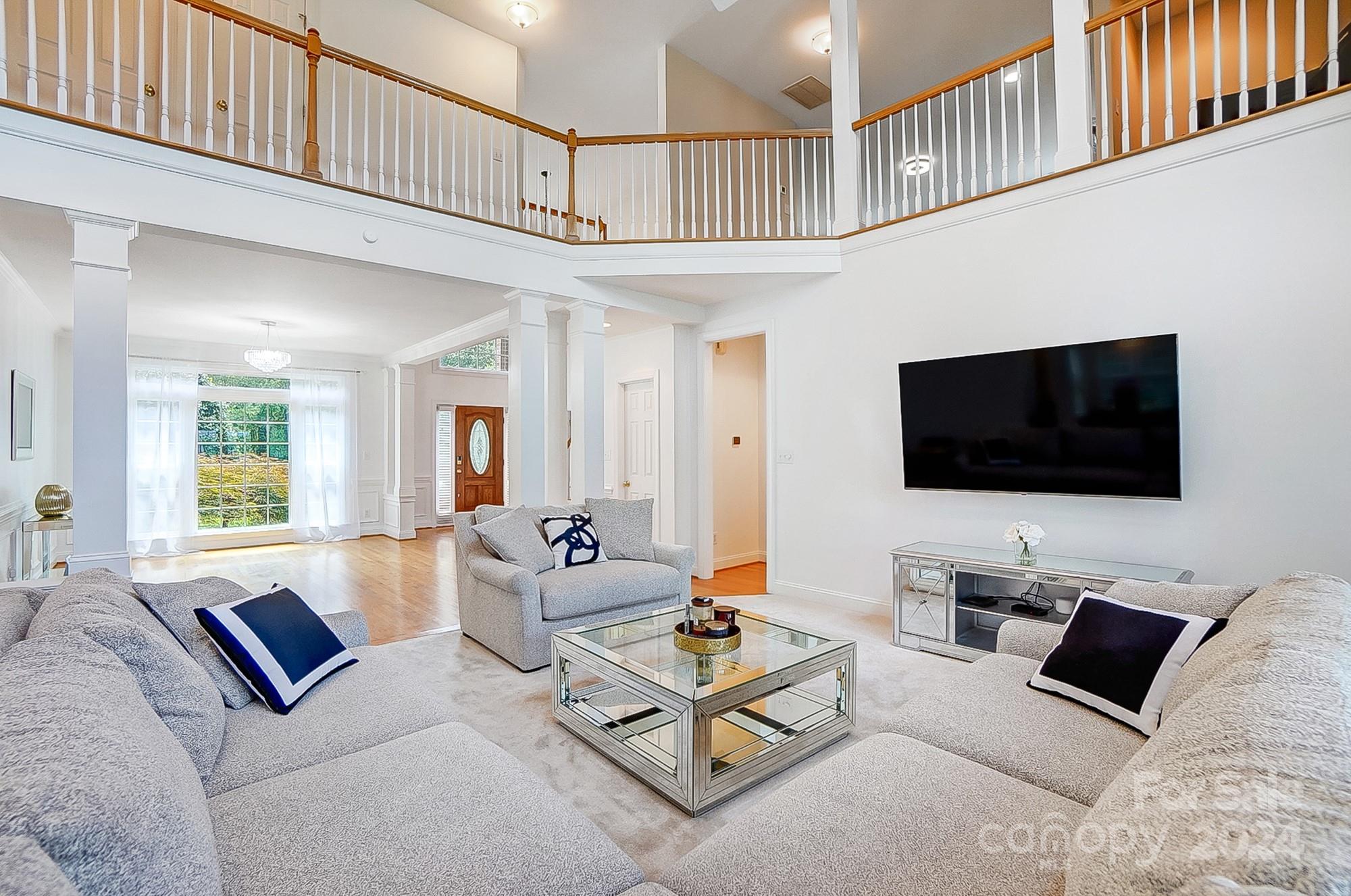 814 Pine Forest Road Charlotte, NC 28214 - Photo 3 of 26 a living room with furniture and a flat screen tv
