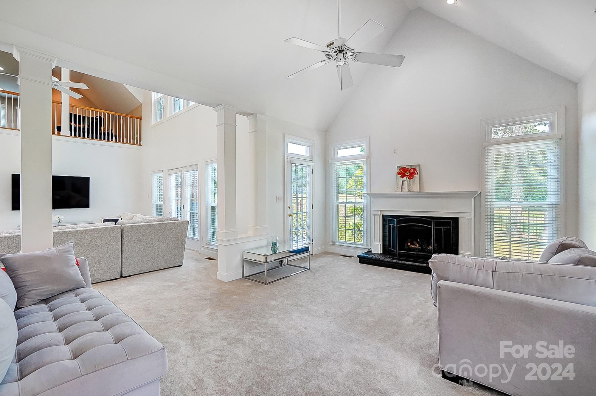 814 Pine Forest Road Charlotte, NC 28214 - Photo 4 of 26 a living room with furniture and a fireplace