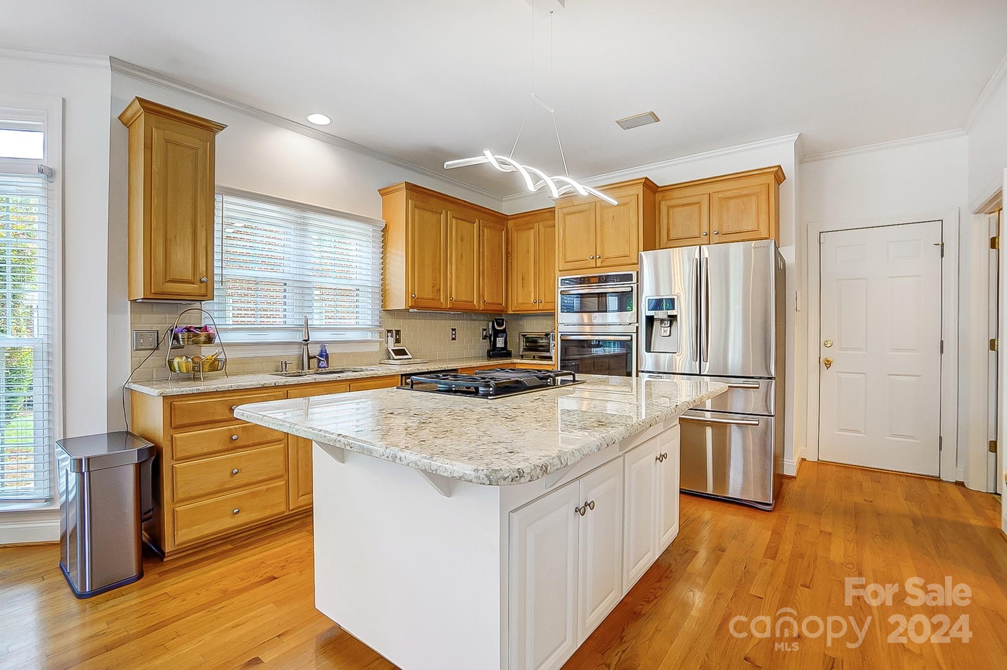 814 Pine Forest Road Charlotte, NC 28214 - Photo 7 of 26 a kitchen with stainless steel appliances granite countertop a sink stove and refrigerator