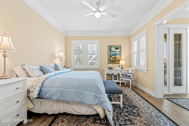 a bed room with a bed and a chair