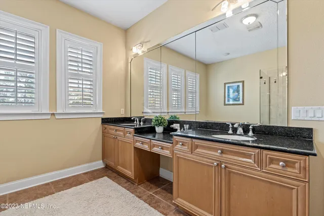 a kitchen with stainless steel appliances granite countertop a sink a stove and a granite counter tops