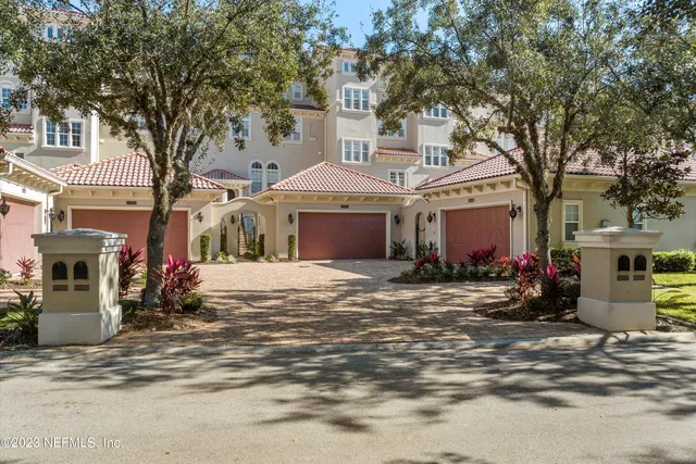 a view of a building with a trees in the background