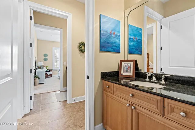 a en suite bathroom with a sink and mirror