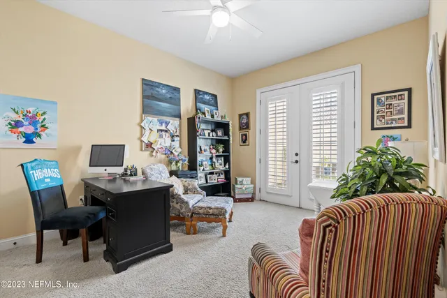 a living room with furniture and a window