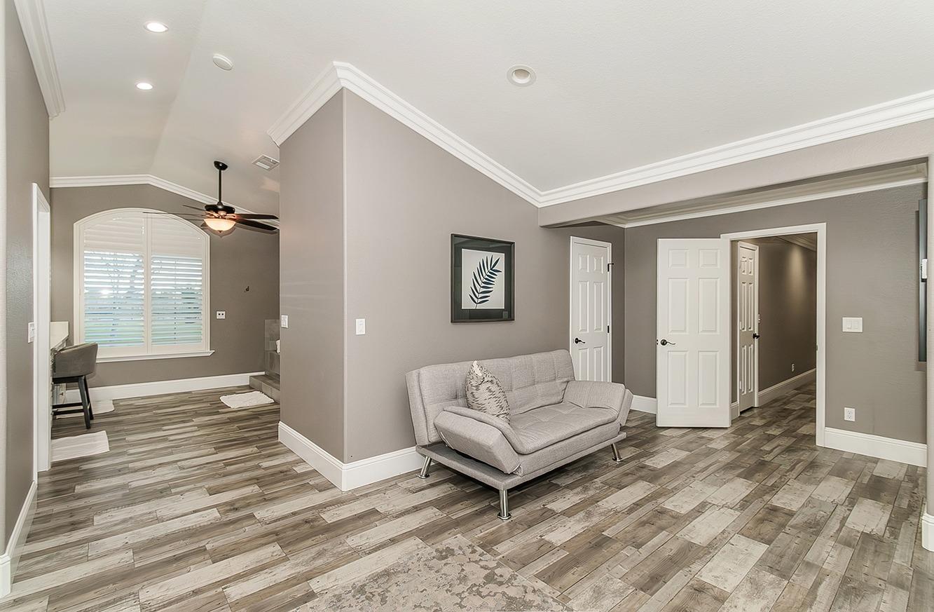 7010 South Frankwood Avenue Reedley, CA 93654 - Photo 21 of 75 a spacious bedroom with a bed and a walk in closet