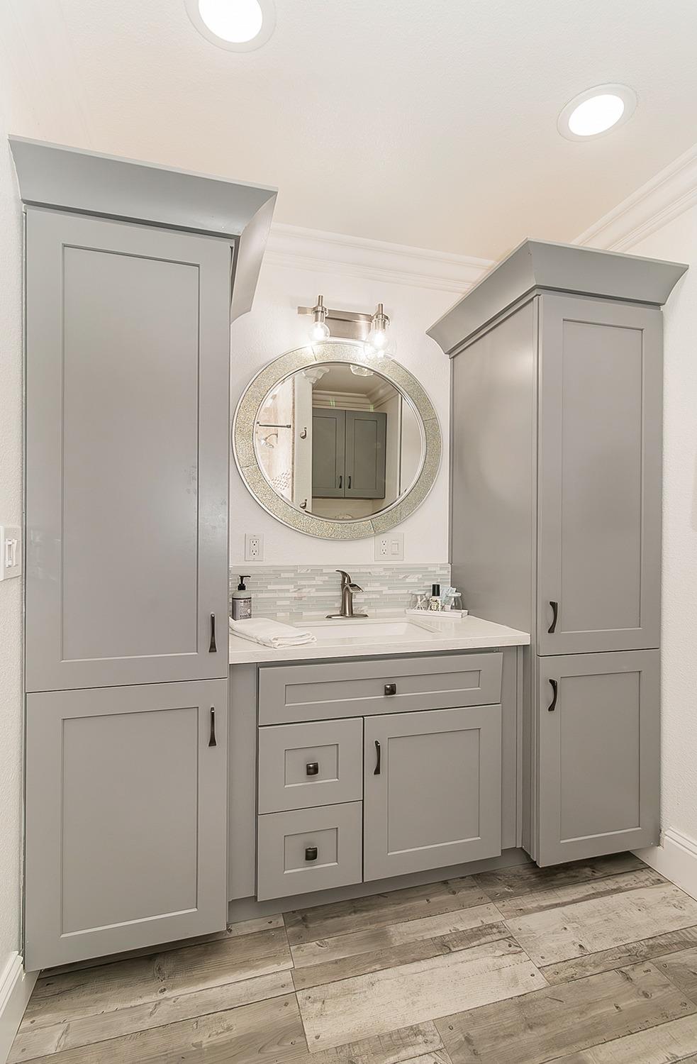 7010 South Frankwood Avenue Reedley, CA 93654 - Photo 28 of 75 a spacious bathroom with a granite countertop sink and a mirror