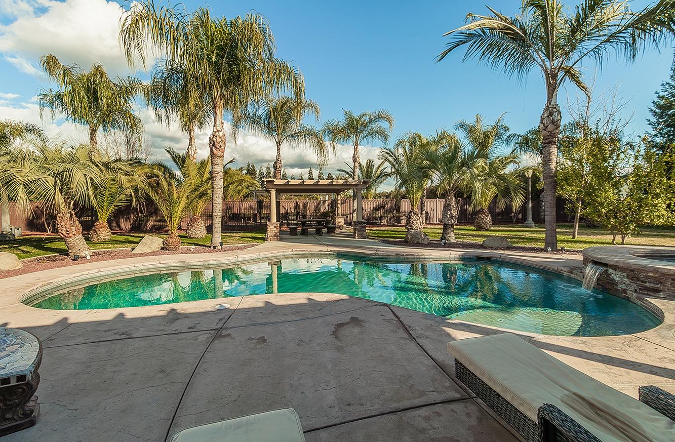 7010 South Frankwood Avenue Reedley, CA 93654 - Photo 41 of 75 a view of a swimming pool with a patio