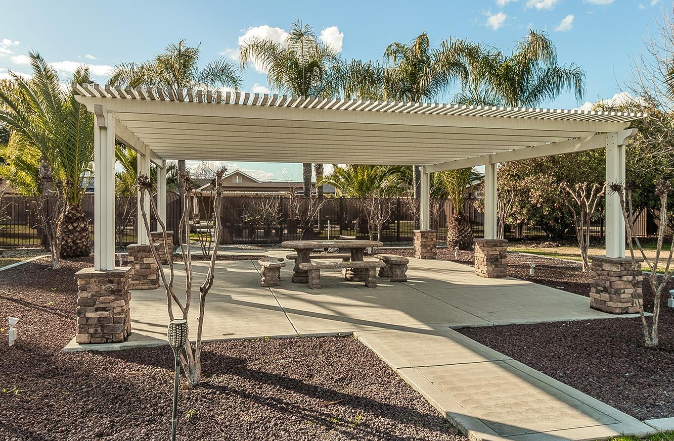 7010 South Frankwood Avenue Reedley, CA 93654 - Photo 55 of 75 a view of a building with sitting area