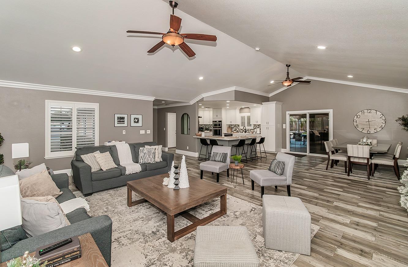7010 South Frankwood Avenue Reedley, CA 93654 - Photo 6 of 75 a living room with furniture kitchen view and a large window