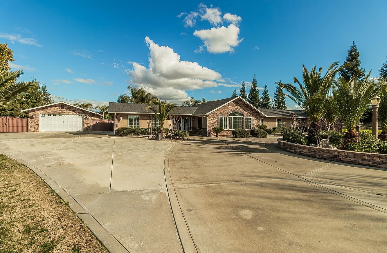 7010 South Frankwood Avenue Reedley, CA 93654 - Photo 62 of 75 a view of house with outdoor space and sitting area