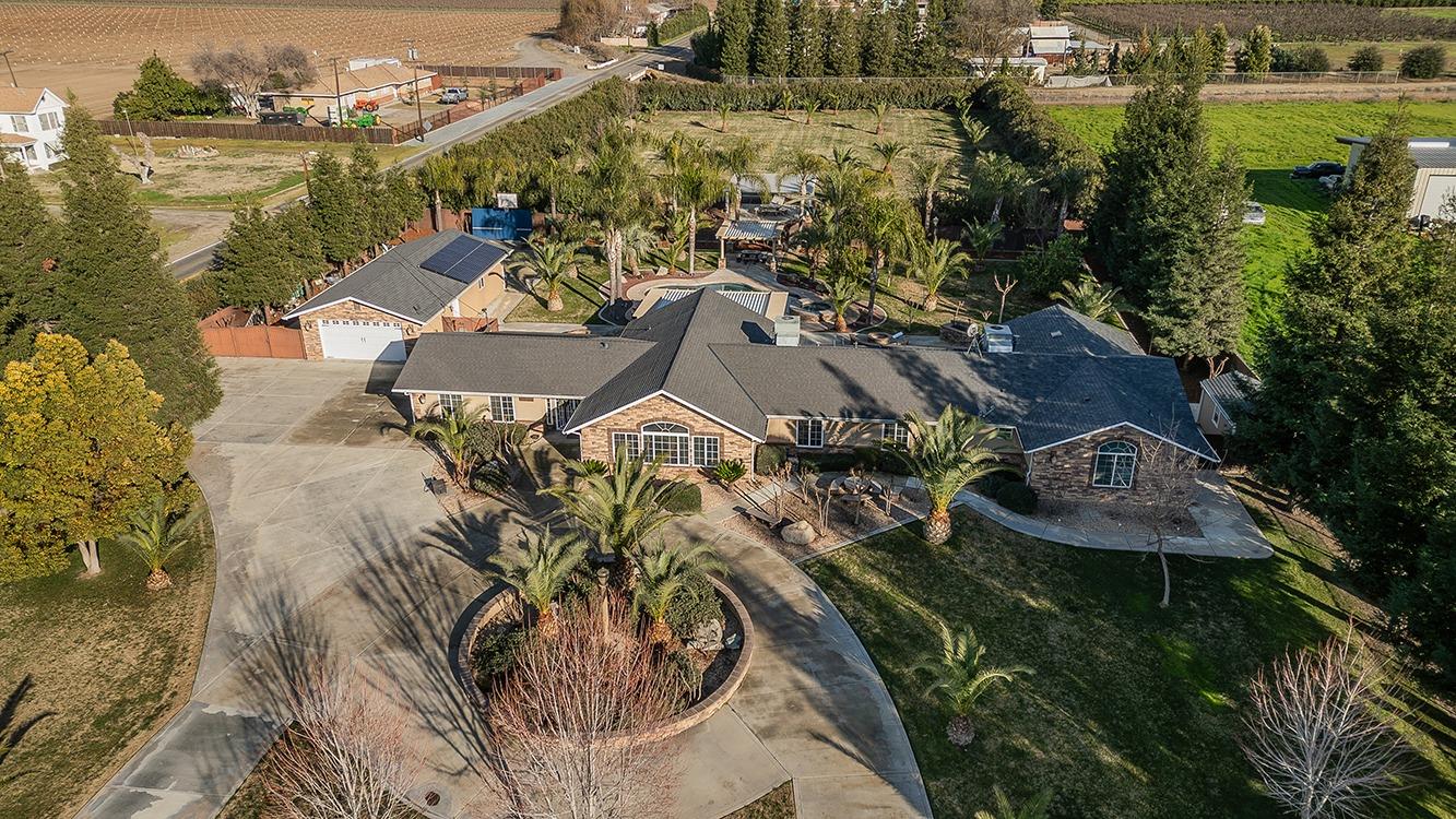 7010 South Frankwood Avenue Reedley, CA 93654 - Photo 65 of 75 an aerial view of a house with outdoor space
