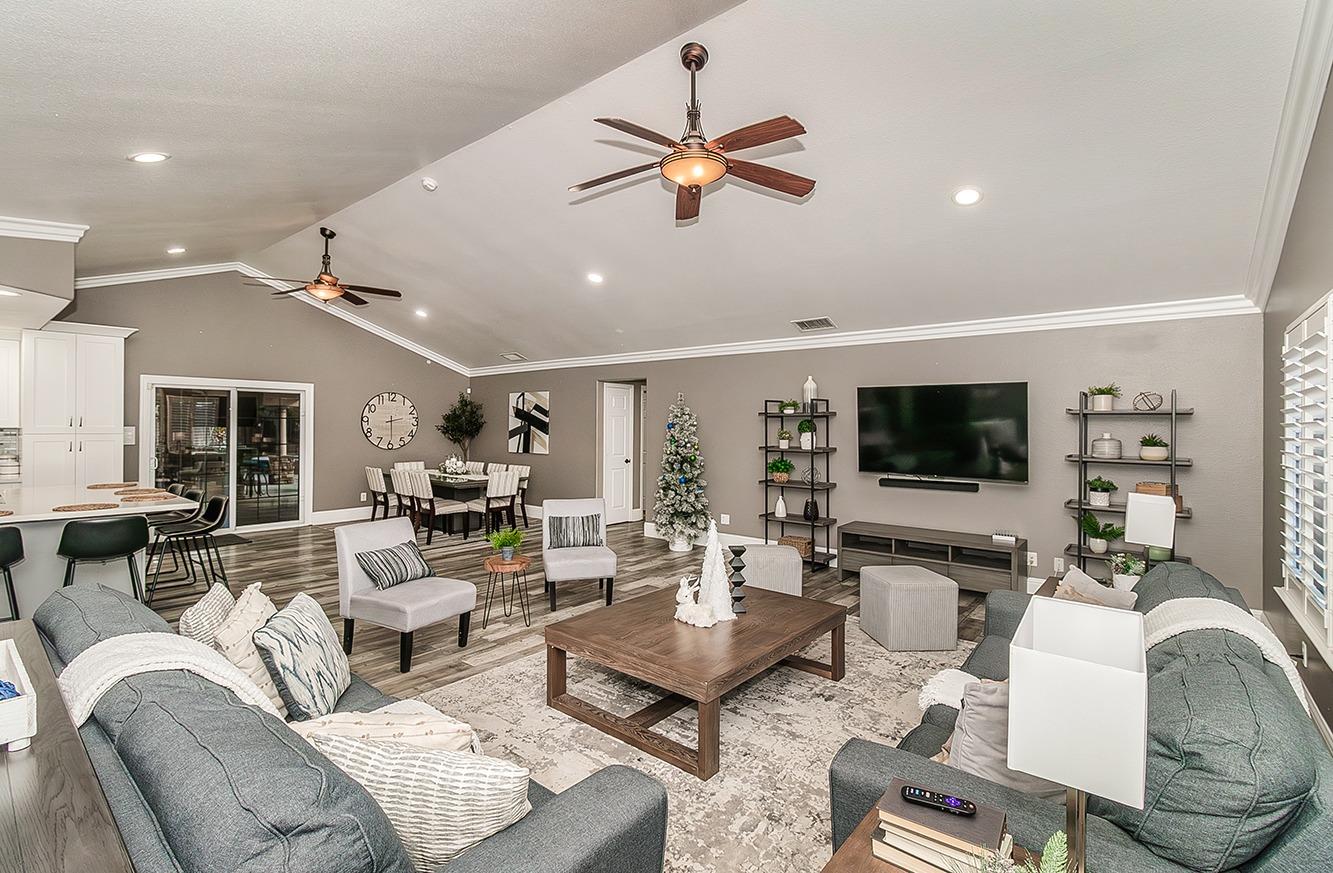 7010 South Frankwood Avenue Reedley, CA 93654 - Photo 7 of 75 a living room with furniture and a flat screen tv