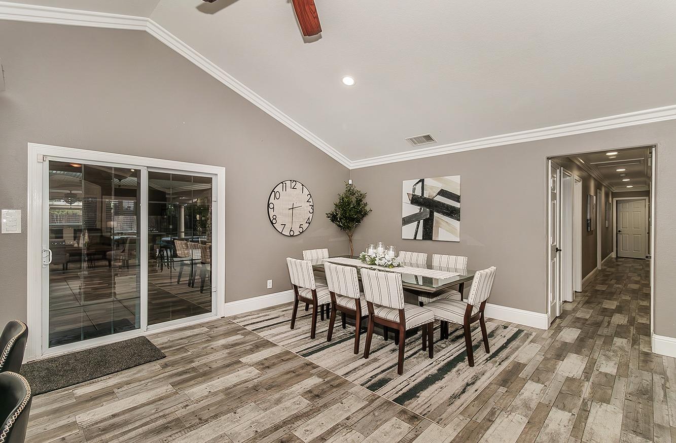 7010 South Frankwood Avenue Reedley, CA 93654 - Photo 8 of 75 a view of a dining room with furniture and window
