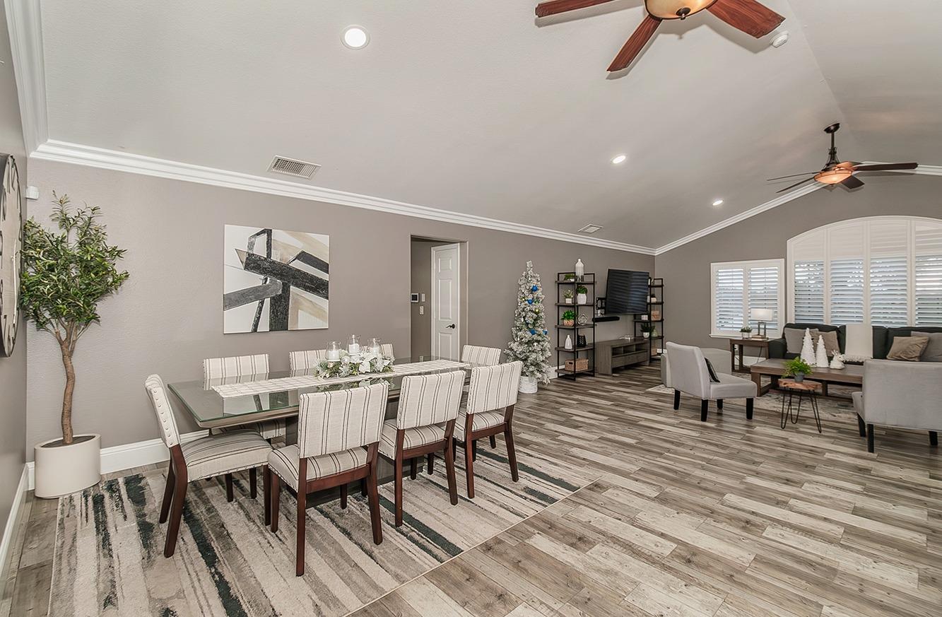 7010 South Frankwood Avenue Reedley, CA 93654 - Photo 10 of 75 a view of a dining room with furniture window and wooden floor