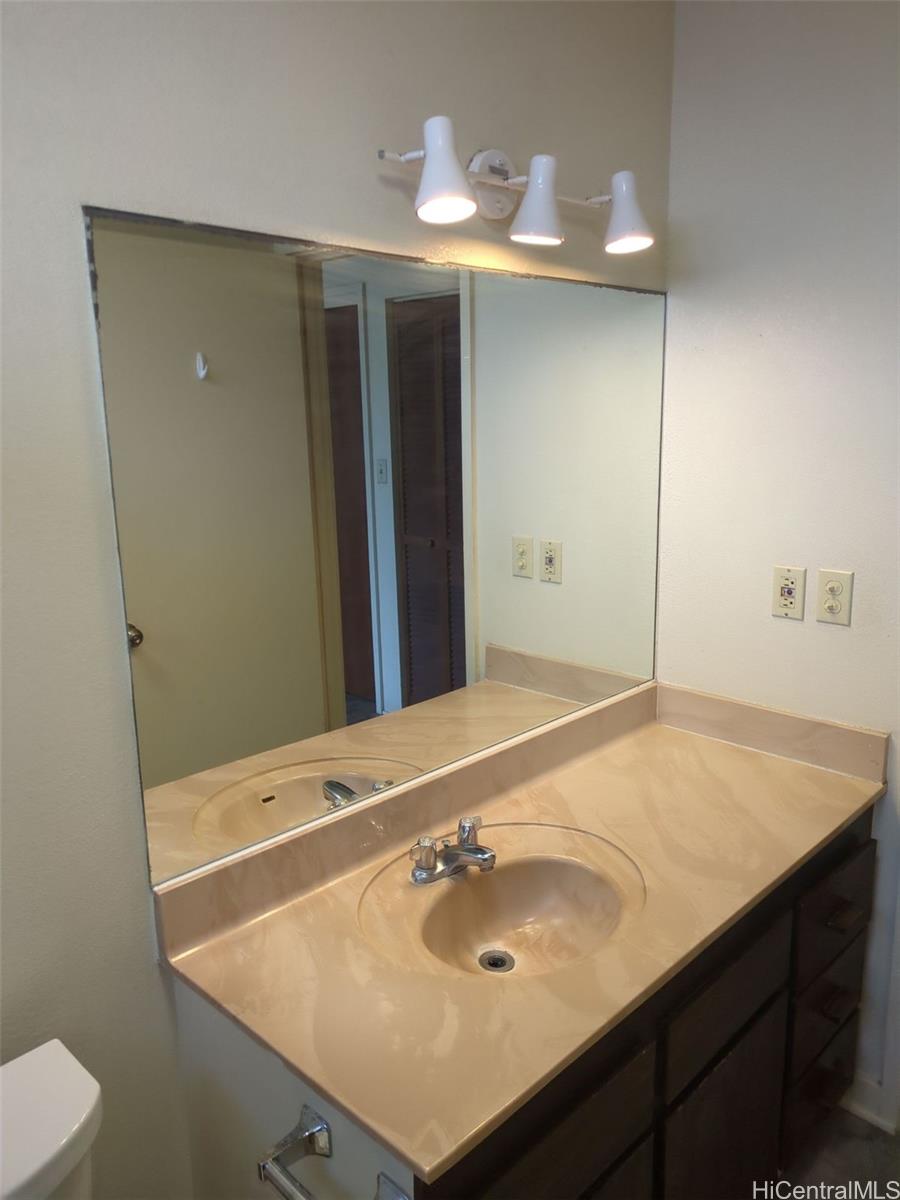 1042 17th Avenue Honolulu, HI 96816 - Photo 11 of 16 a bathroom with a sink vanity and a mirror