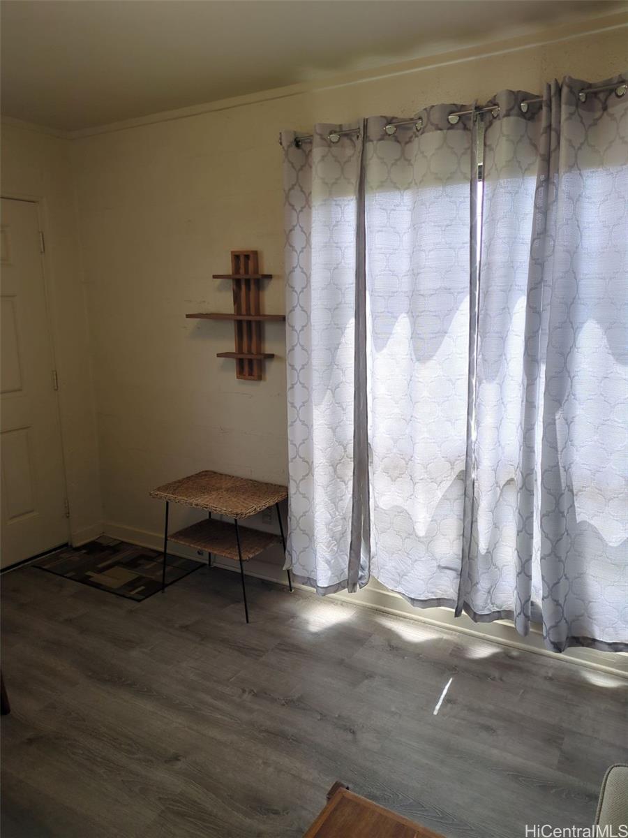 1042 17th Avenue Honolulu, HI 96816 - Photo 7 of 16 a view of a room with wooden floor and a window