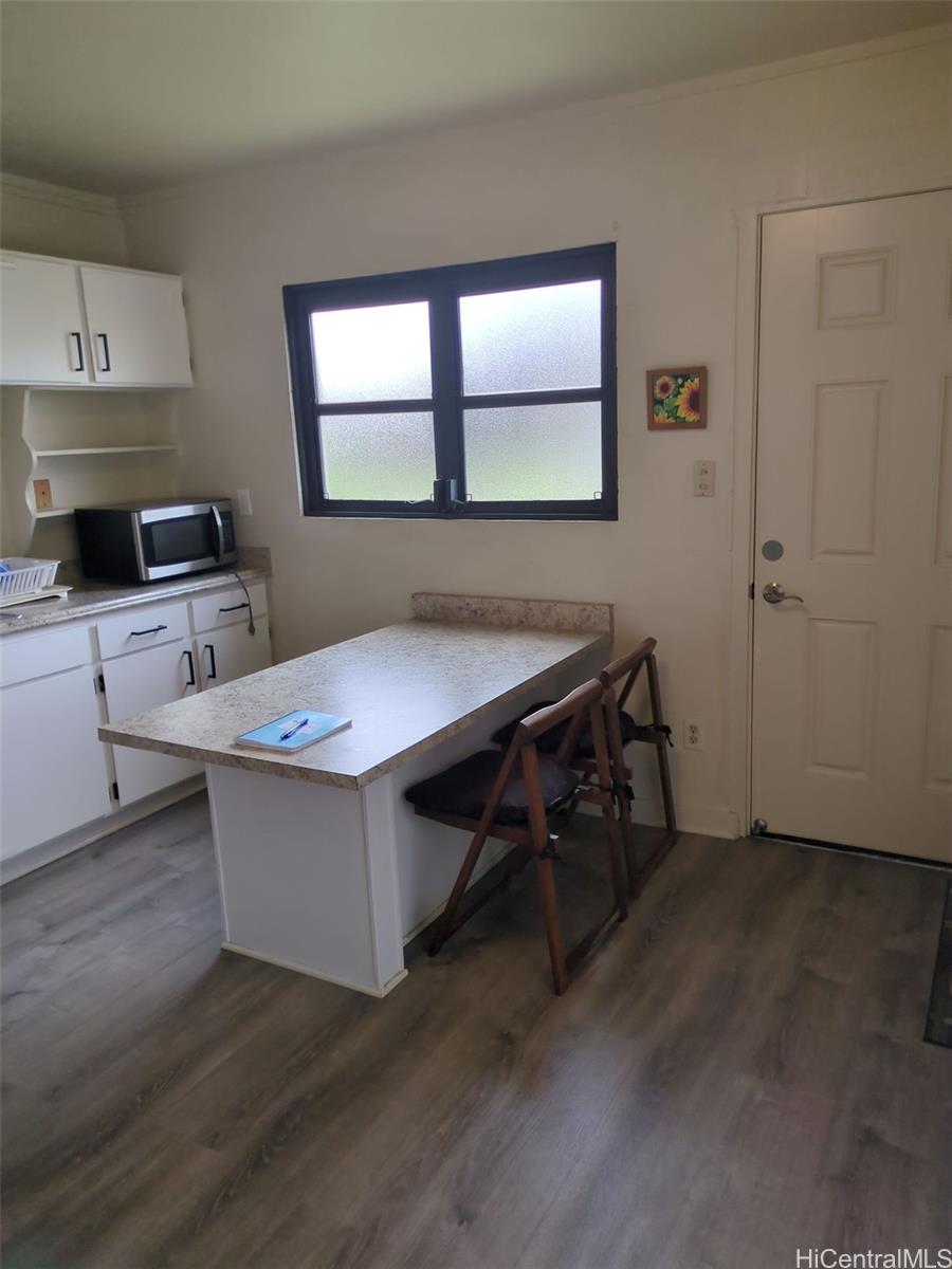 1042 17th Avenue Honolulu, HI 96816 - Photo 8 of 16 a room with furniture a window and wooden floor