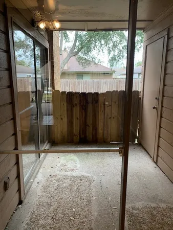 a view of an empty room with a fan