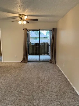 a kitchen with a refrigerator and a sink