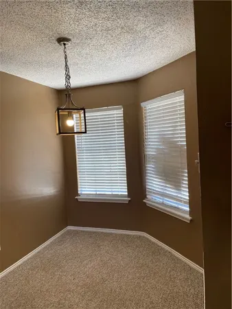a bathroom with a sink mirror and toilet
