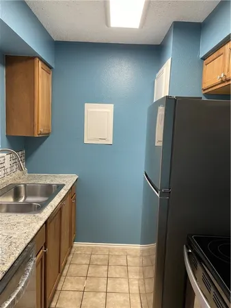 a bathroom with a toilet a sink and bathtub