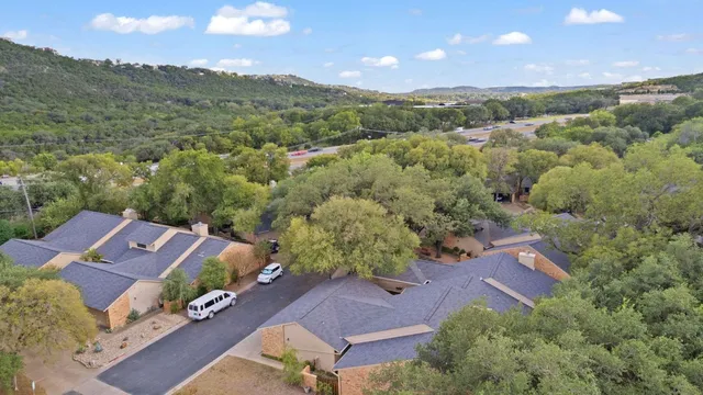 an aerial view of a house with a garden