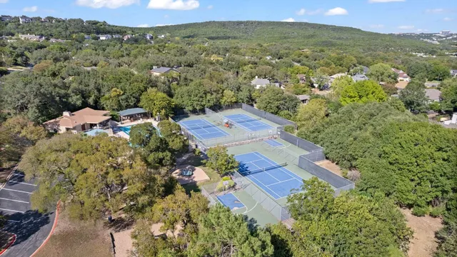 an aerial view of a house with a yard