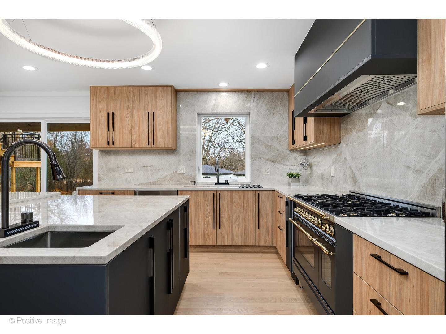 2005 Malory Lane Highland Park, IL 60035 - Photo 11 of 48 a kitchen with stainless steel appliances granite countertop a sink stove and cabinets